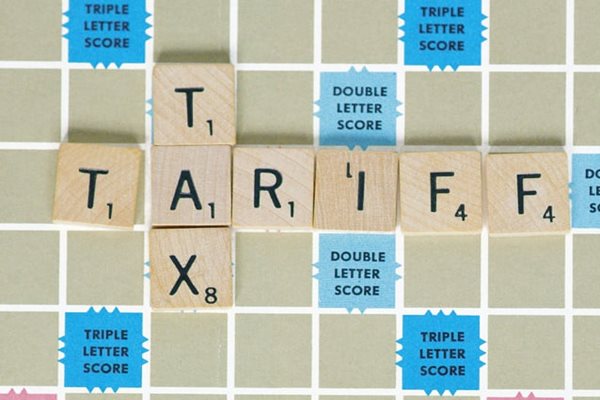 Tariff and Tax spelled on a Scrabble board