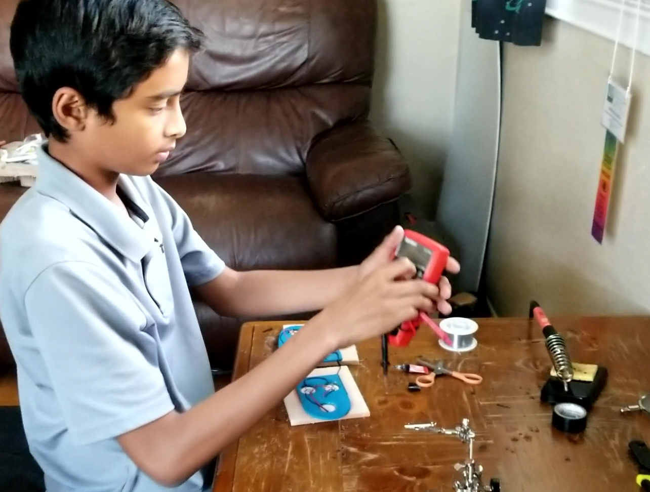 Child working on an invention
