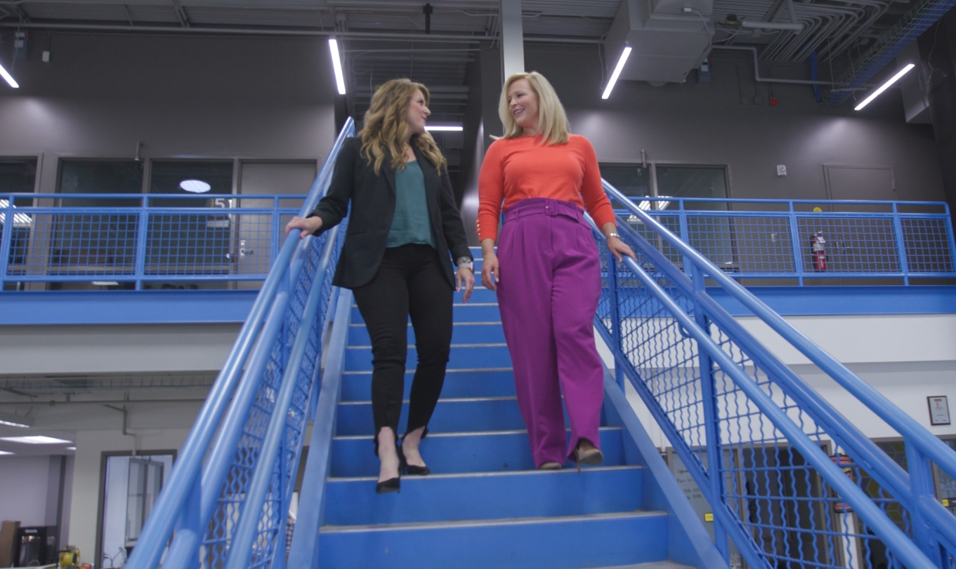 Kim and Melissa walking down stairs